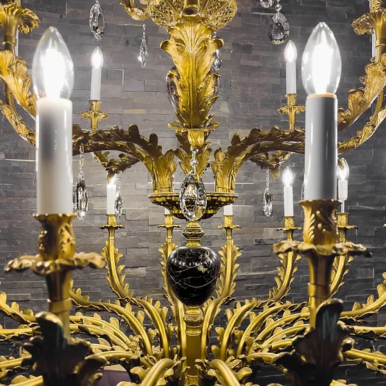 A bronze chandelier close up at Leo Light Lighting.